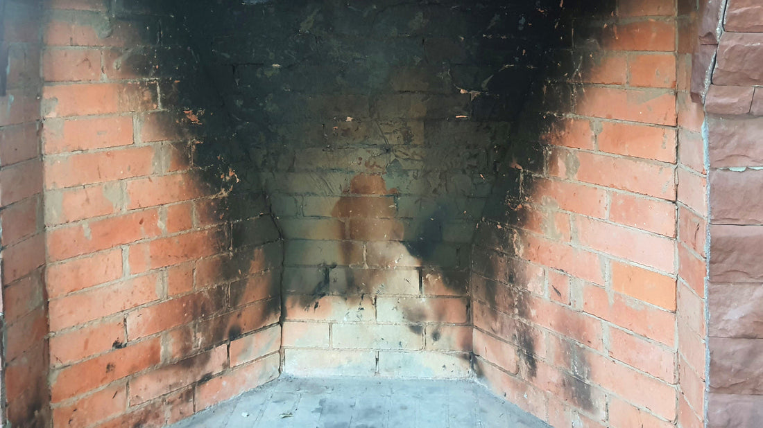 soot stained brick fireplace