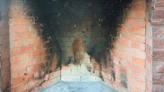 soot stained brick fireplace